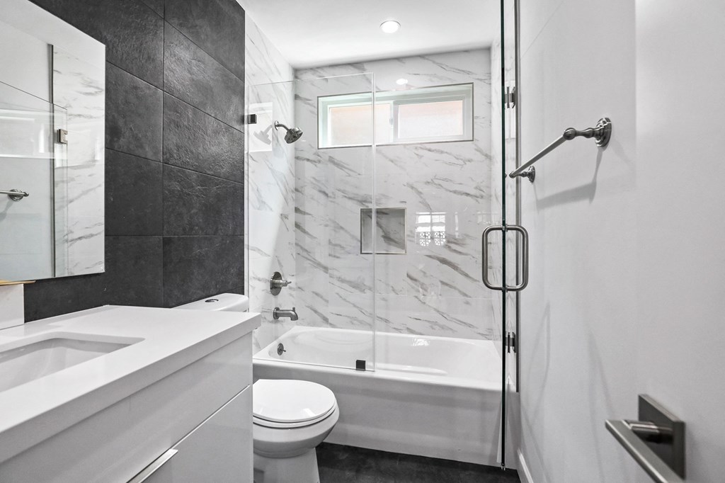 Bathroom with Shower-Bath with Glass Door and Vanity Cabinet Storage