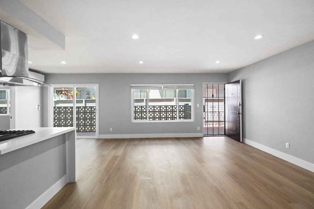 Open-Concept Kitchen, Dining, and Living Room Space with Large-Size Windows