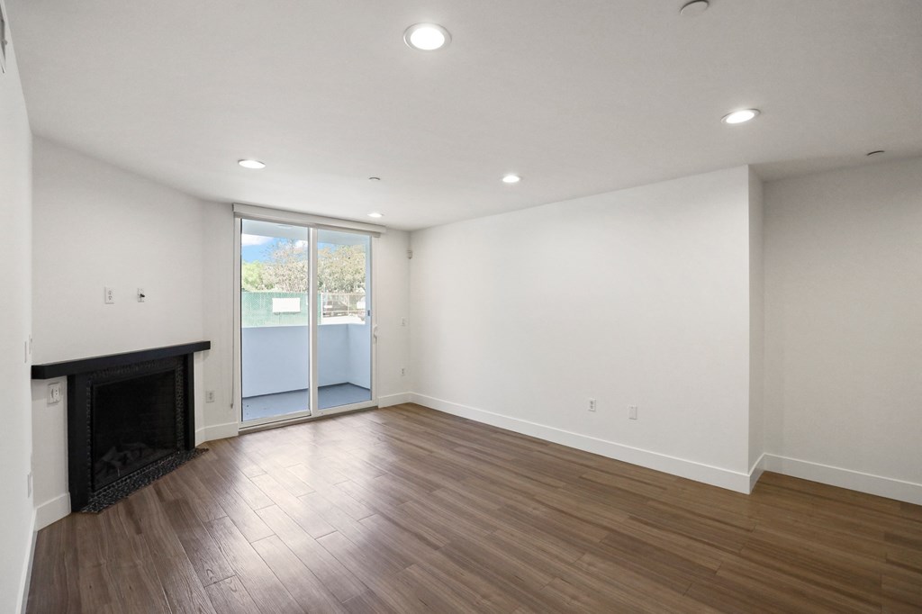 Living Room with Electric Fireplace, Recessed Lighting, Vinyl Flooring, and Patio