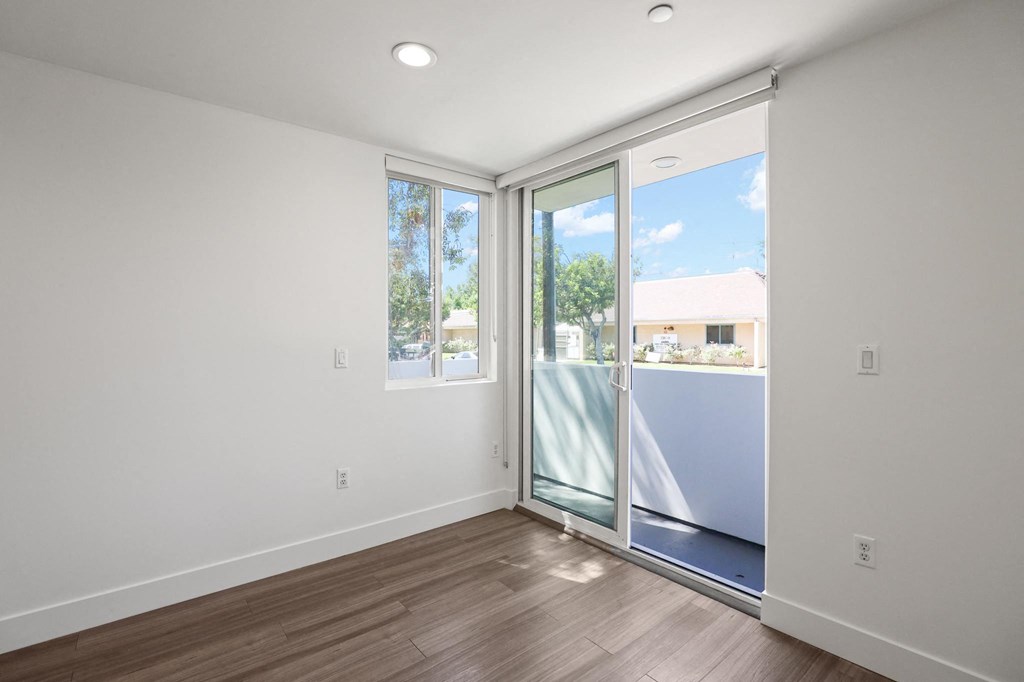 Bedroom with Windows and Patio