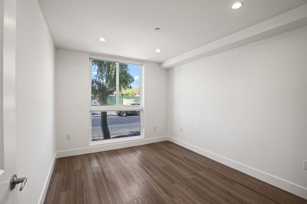 Bedroom with Recessed Lighting, Vinyl Flooring, and Large-Size Windows