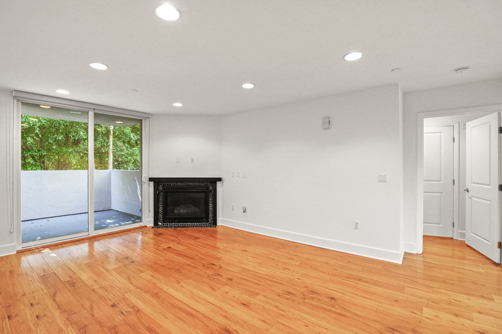 Living Room with Electric Fireplace and Patio
