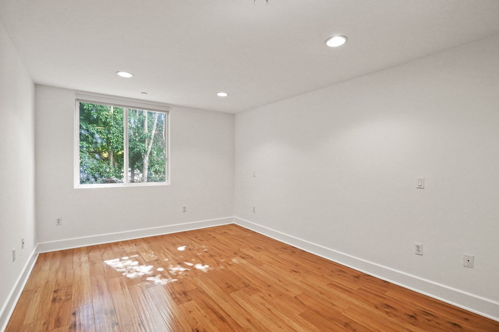 Bedroom with Vinyl Flooring and Window