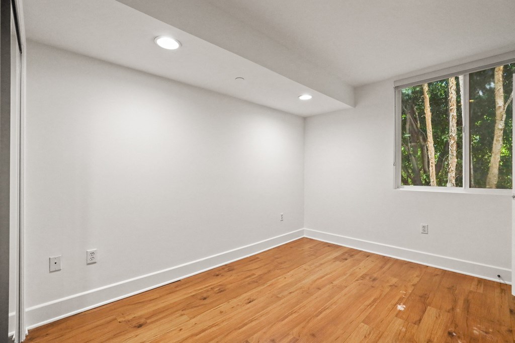 Bedroom with Recessed Lighting, Vinyl Flooring, and Windows