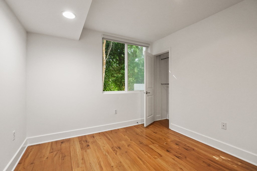 Bedroom with Recessed Lighting, Vinyl Flooring, and Windows