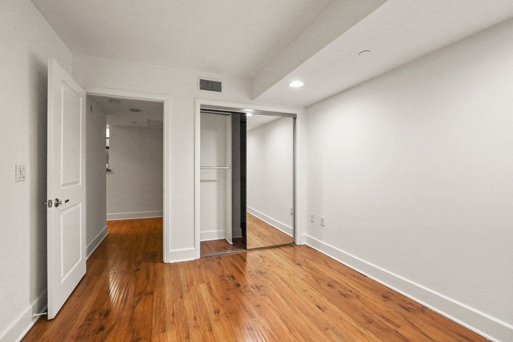 Bedroom with Mirrored Closet