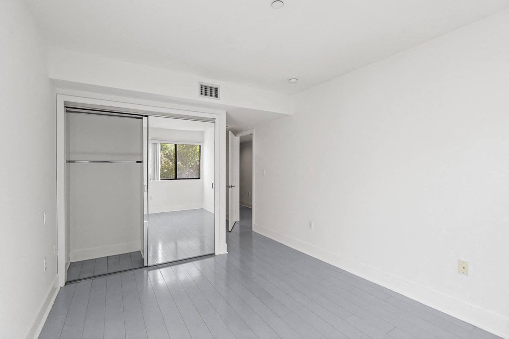bedroom facing closet and entrance
