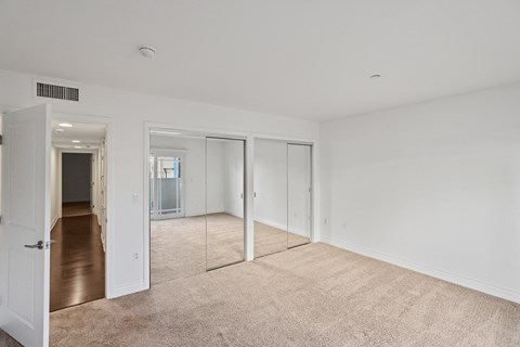 Bedroom with Two Mirrored Closets