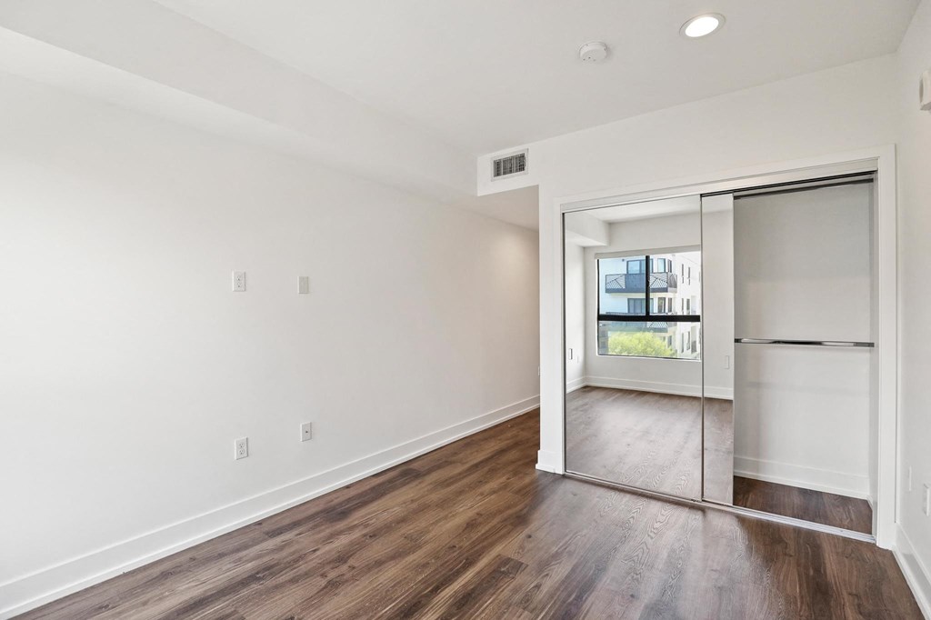 Bedroom with Closet and Vinyl  Flooring