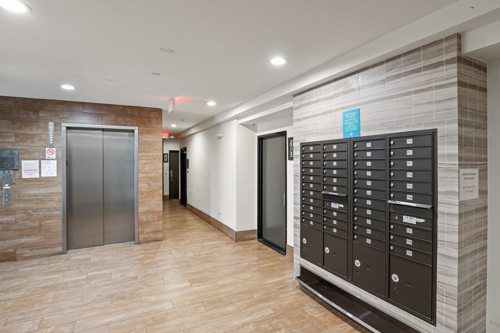 Lobby Area with Resident Mailboxes and Elevator