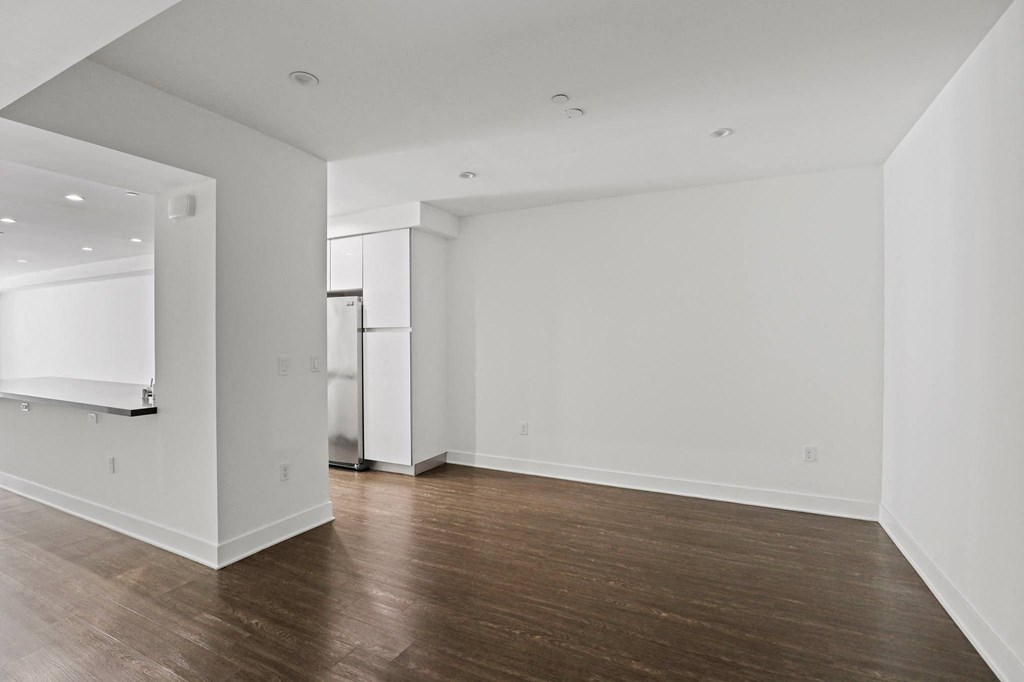 Dining Space with High Ceilings and Vinyl Flooring