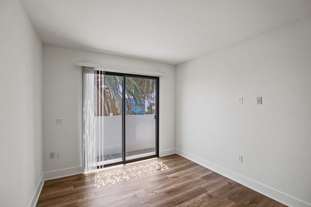 Bedroom with Balcony and Vinyl Flooring