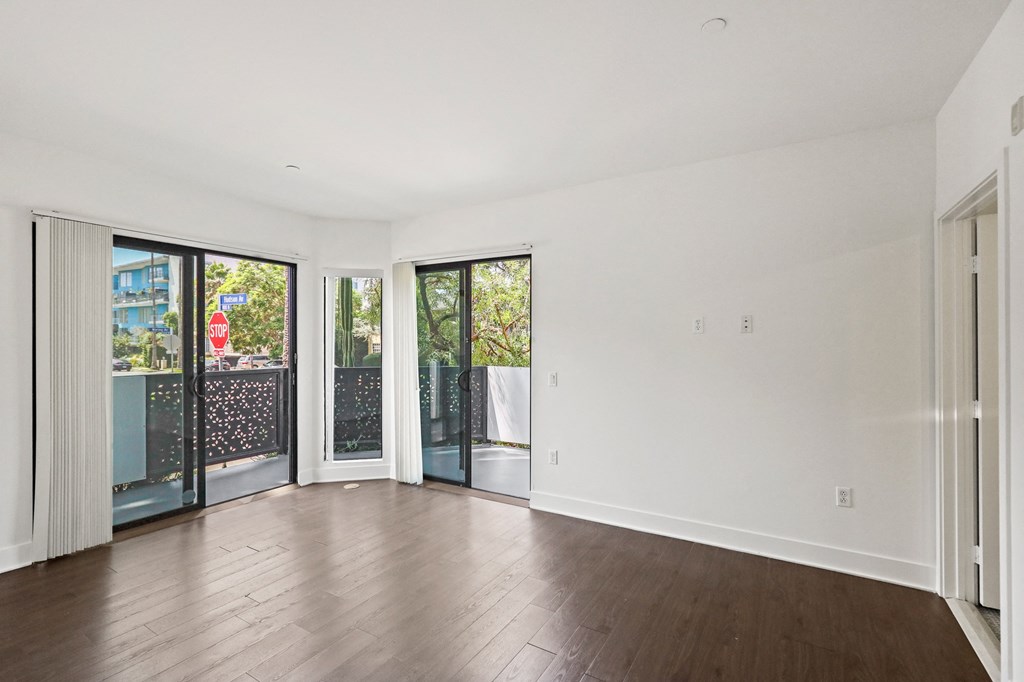Bedroom with Walk-In Closet, Bathroom, and Patio