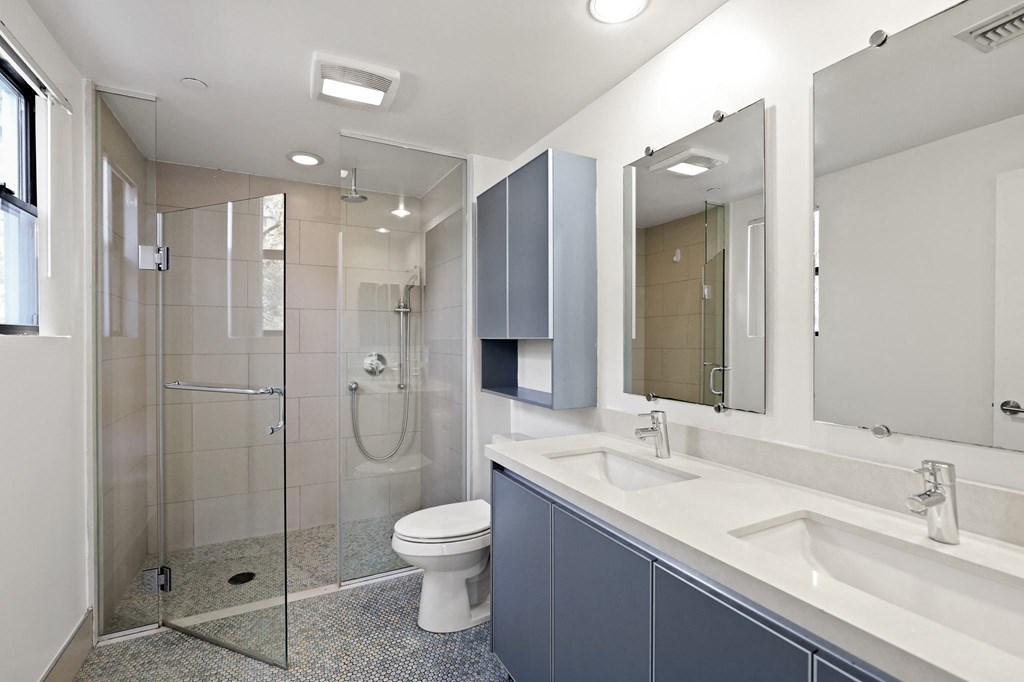 Bathroom with Walk-In Shower and Double Vanity with Cabinet Storage