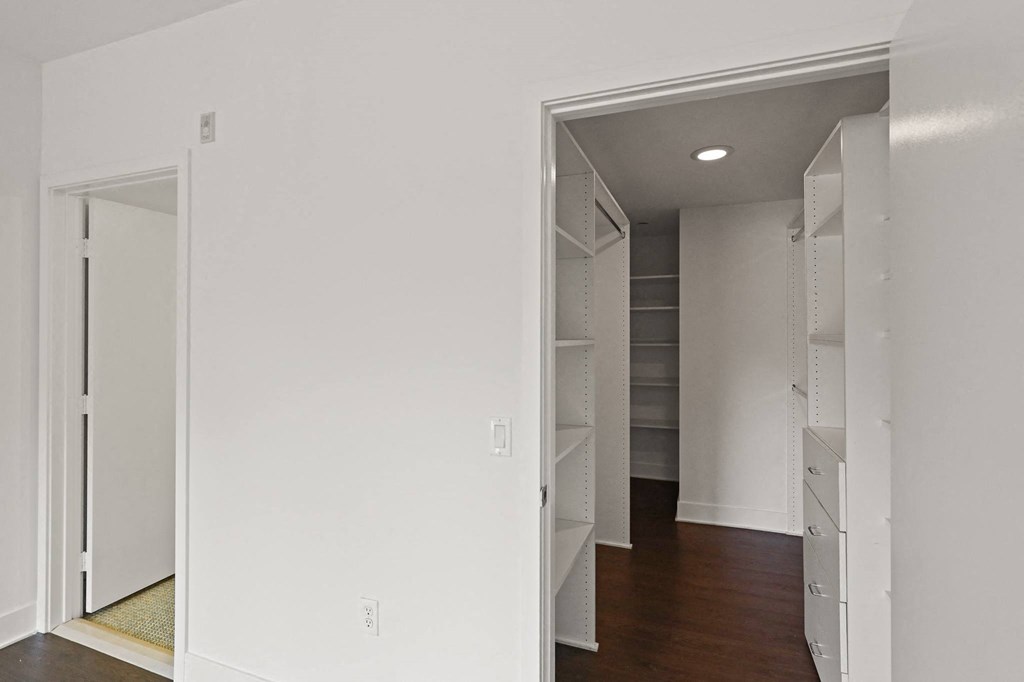 Large Walk-In Closets with Built-In Organizers