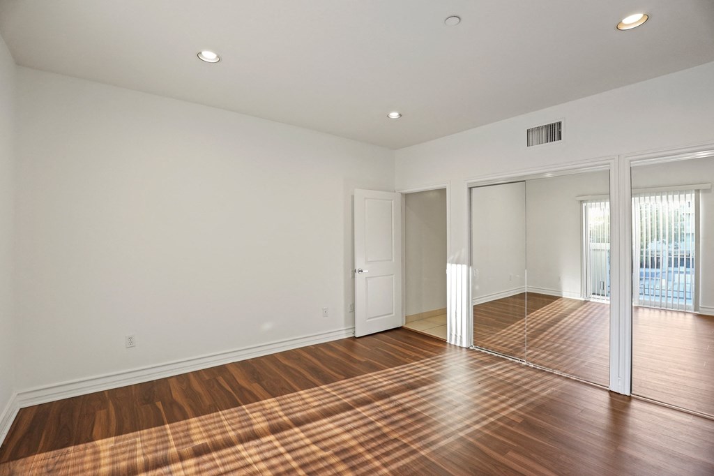 Large-Size Bedroom with Double Closets and Vinyl Flooring
