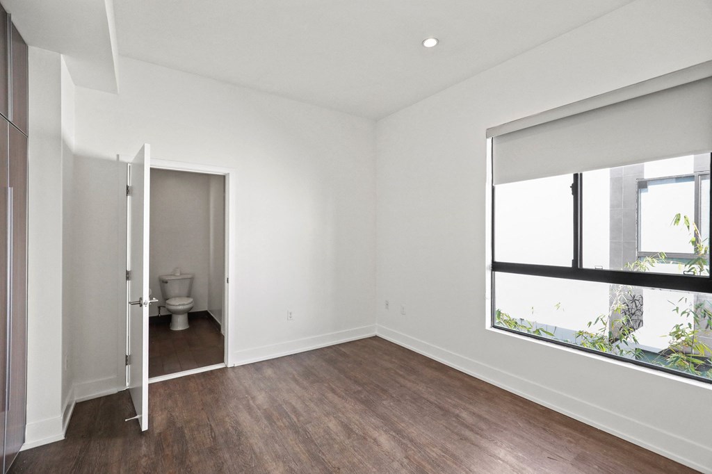 Bedroom with Large-Size Windows with Shades