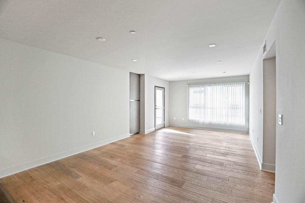 Large-Size Living Room Space with Vinyl Flooring and Patio