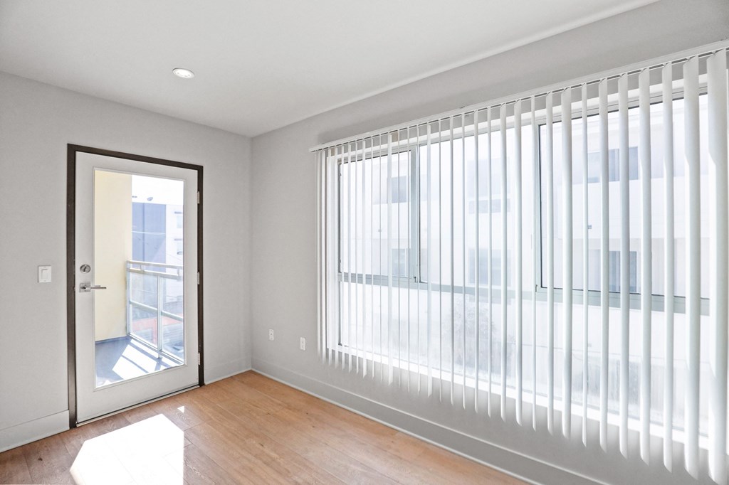Living Room Area with Large Windows and Patio