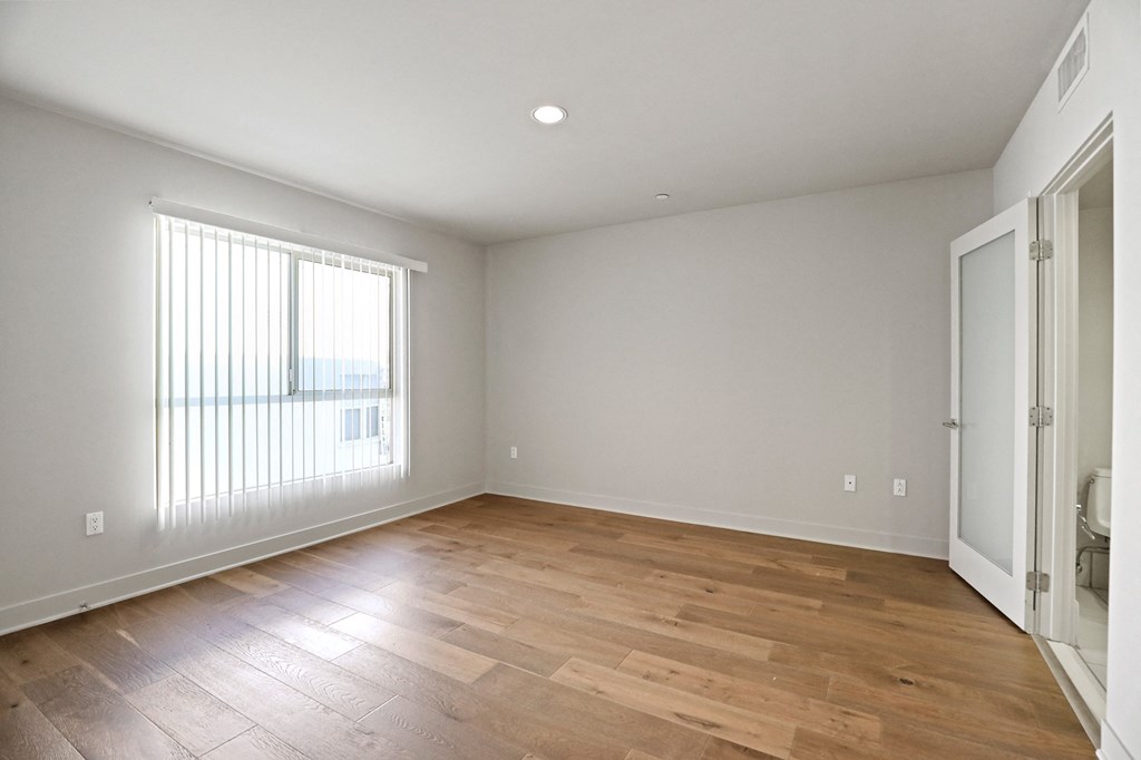 Bedroom with Recessed Lighting, Vinyl Flooring, and Large Windows