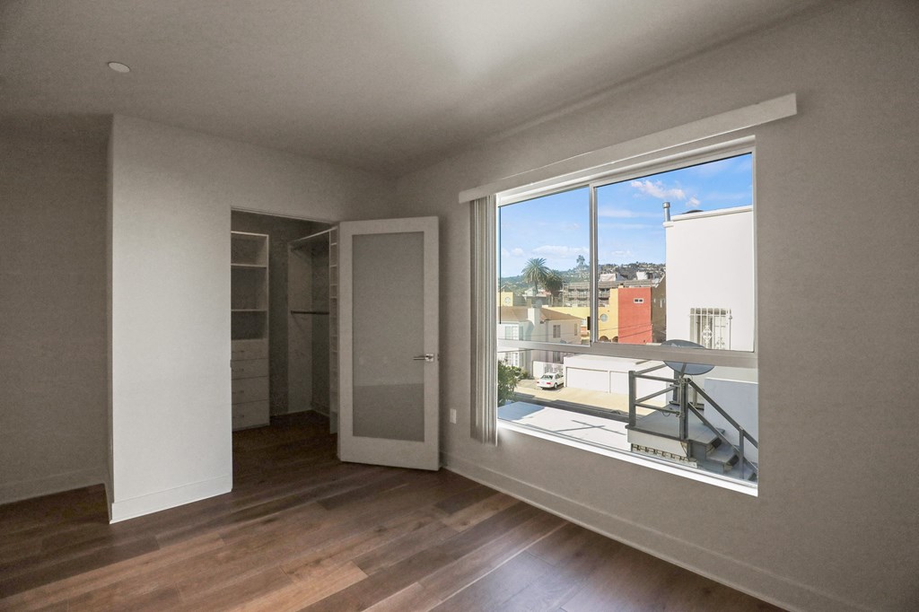 Bedroom with Walk-In Closet with Built-In Organizers