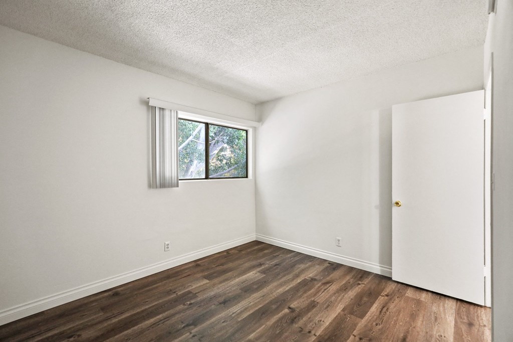 Bedroom with Windows and Vinyl Flooring
