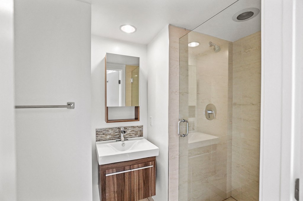 Bathroom with Under Sink Storage and a Standup Showers