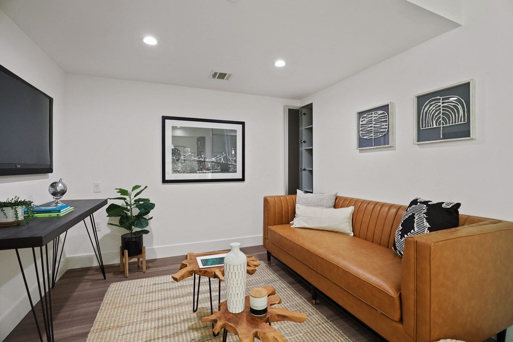 Living Rooms with Vinyl Flooring and Recessed Lighting