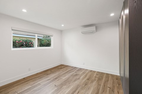 Bedroom with Reccessed Lighting, Closet Storage, and Window