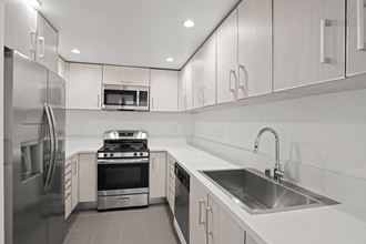 West LA apartment Kitchen with Energy-Efficient Appliances and  Lots of Cabinet - Photo Gallery 5