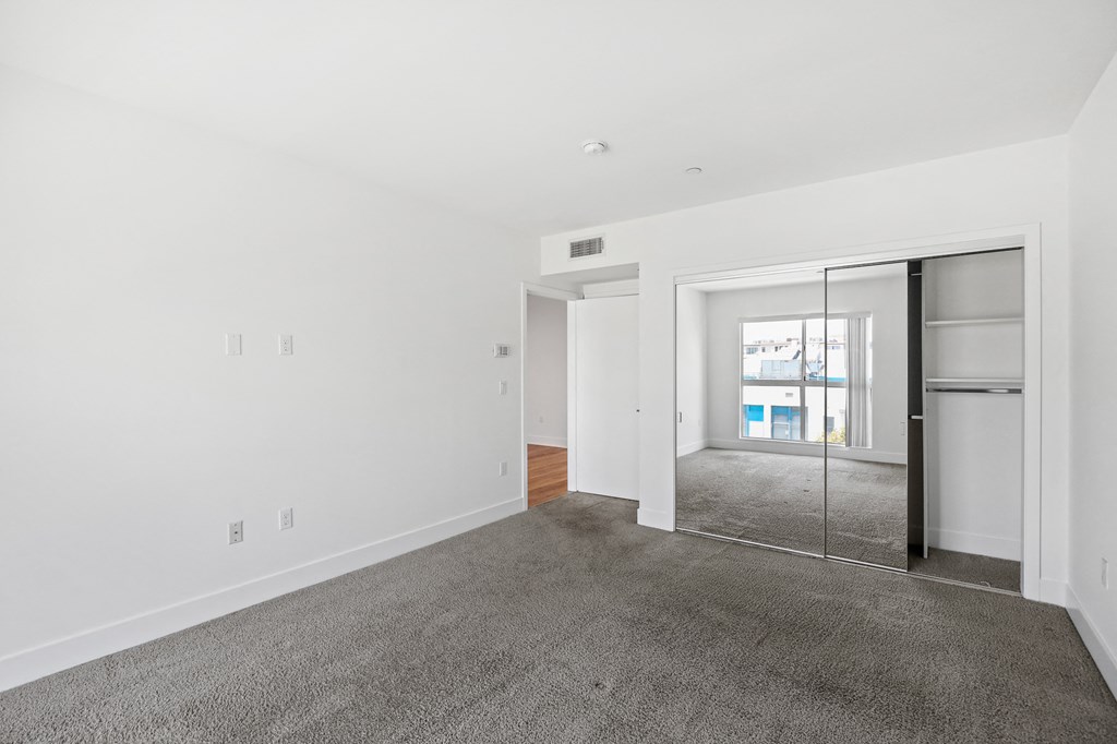 Bedroom with Mirrored Closet