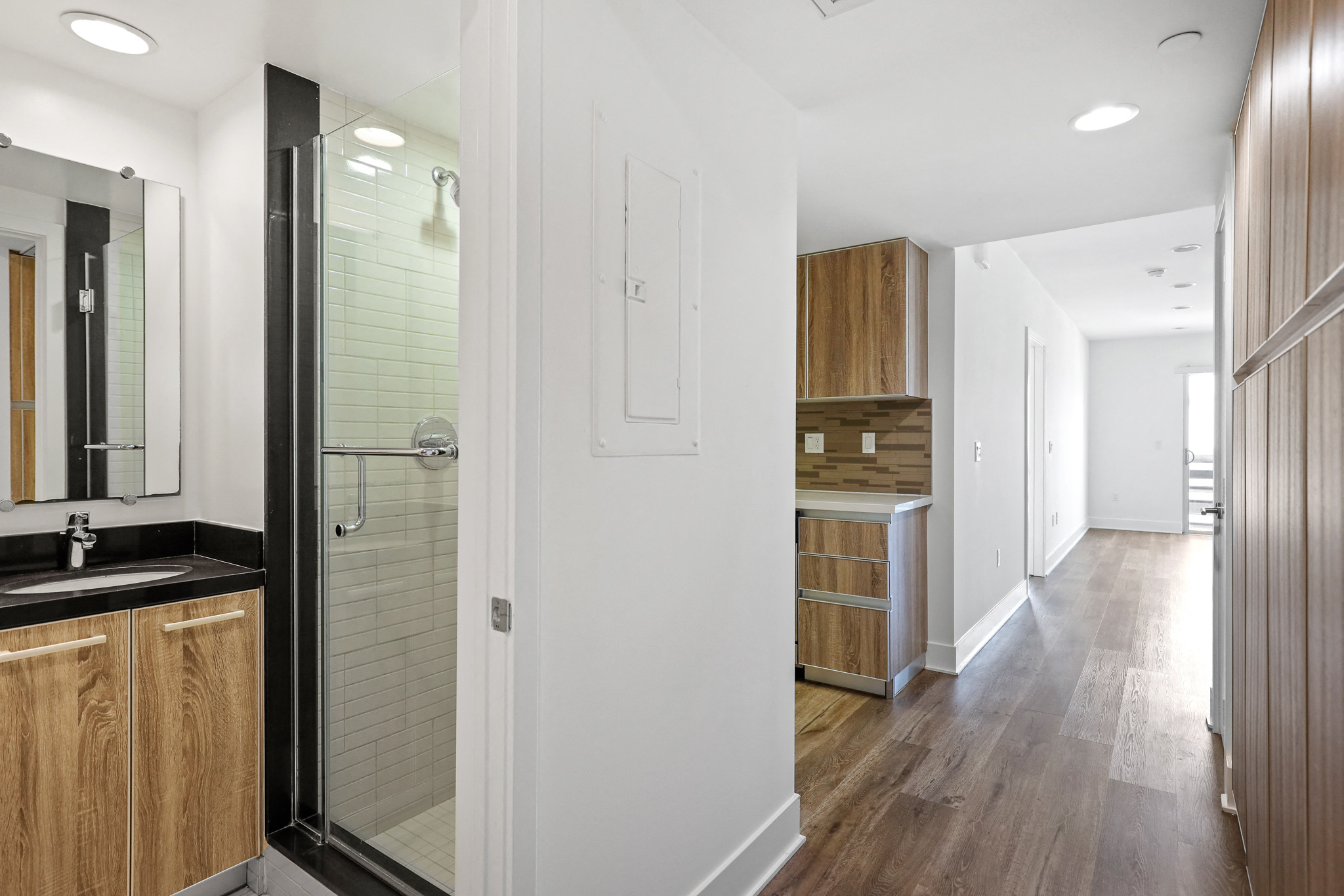 Entrance to Full-Size Guest Bathroom and Hallway Cabinet Storage