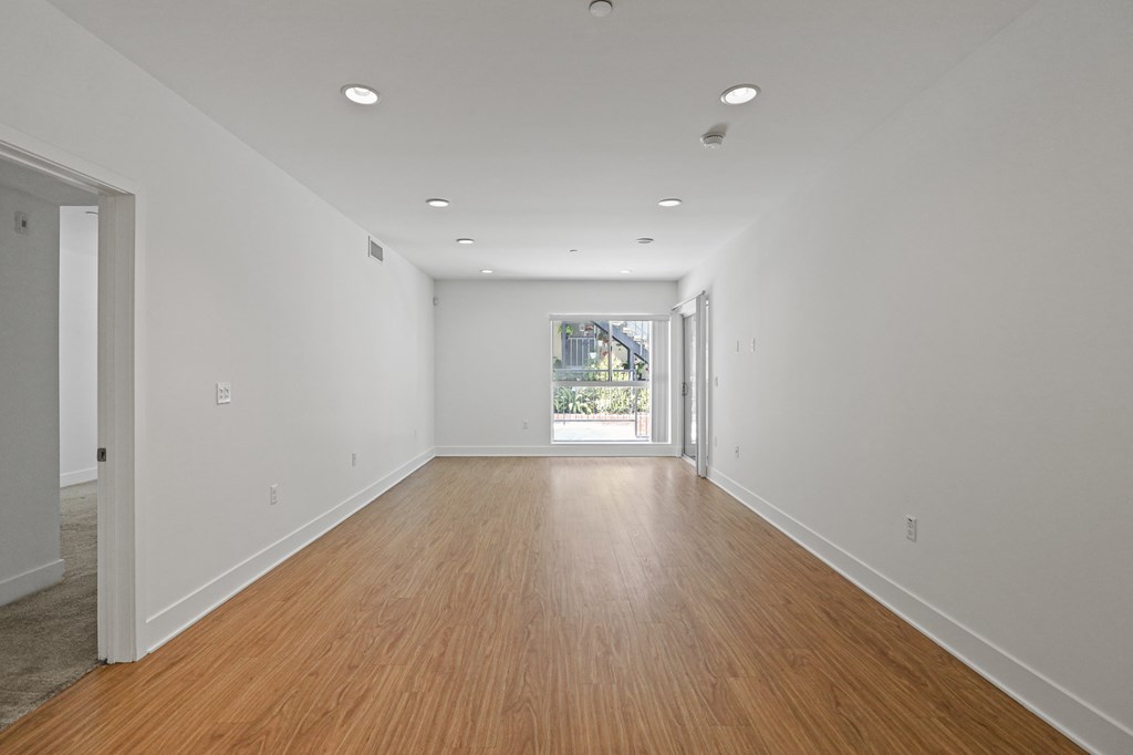 Large Living Room Space with Vinyl Flooring and Recess Lighting