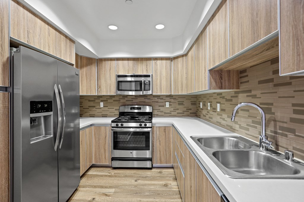 Full-Size Kitchen with Double Sinks, Energy-Efficient Appliances, and Recessed Lighting