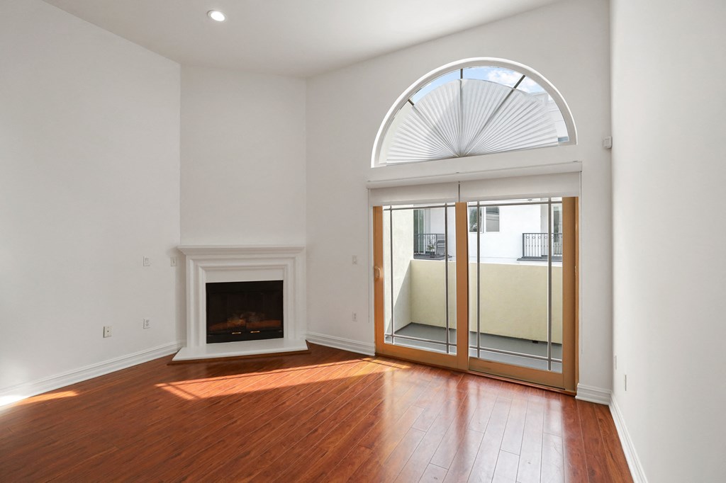 Living Room with Fireplace and Balcony