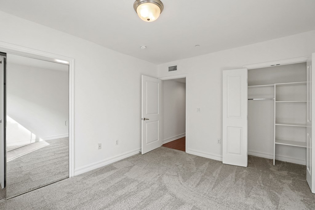 Bedroom with Double Closets with Built-In Organizers