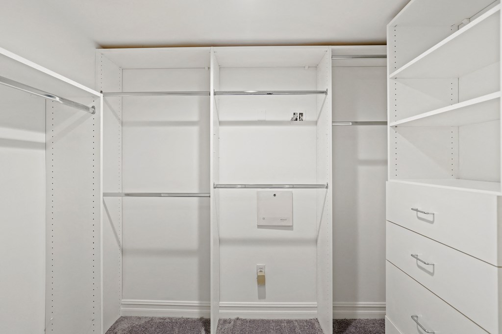 Large Walk-In Closet with Built-In Organization System
