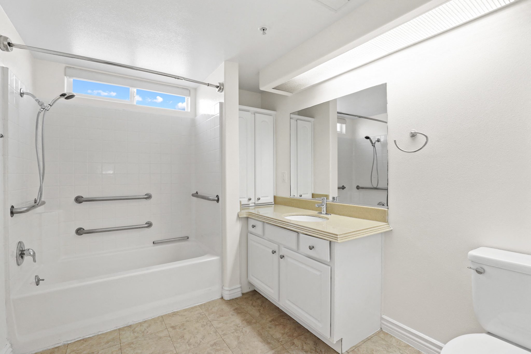 Large Handicap Accessible Bathroom with Full-Size Bathtub