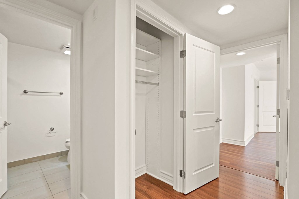 Bedroom with Closet, Bathroom, and Hardwood Flooring