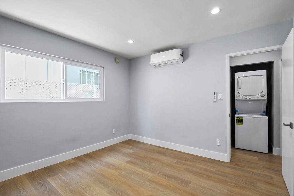 Bedroom with Recessed Lighting, Vinyl Flooring, and Windows