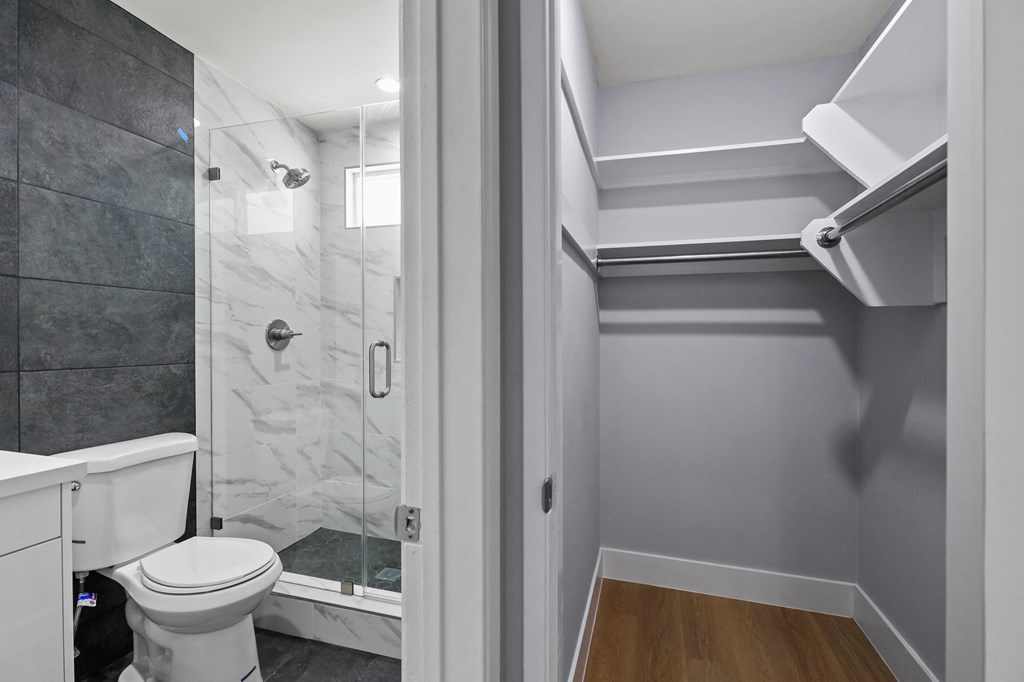 Bathroom with Walk-In Shower and Closet with Shelving