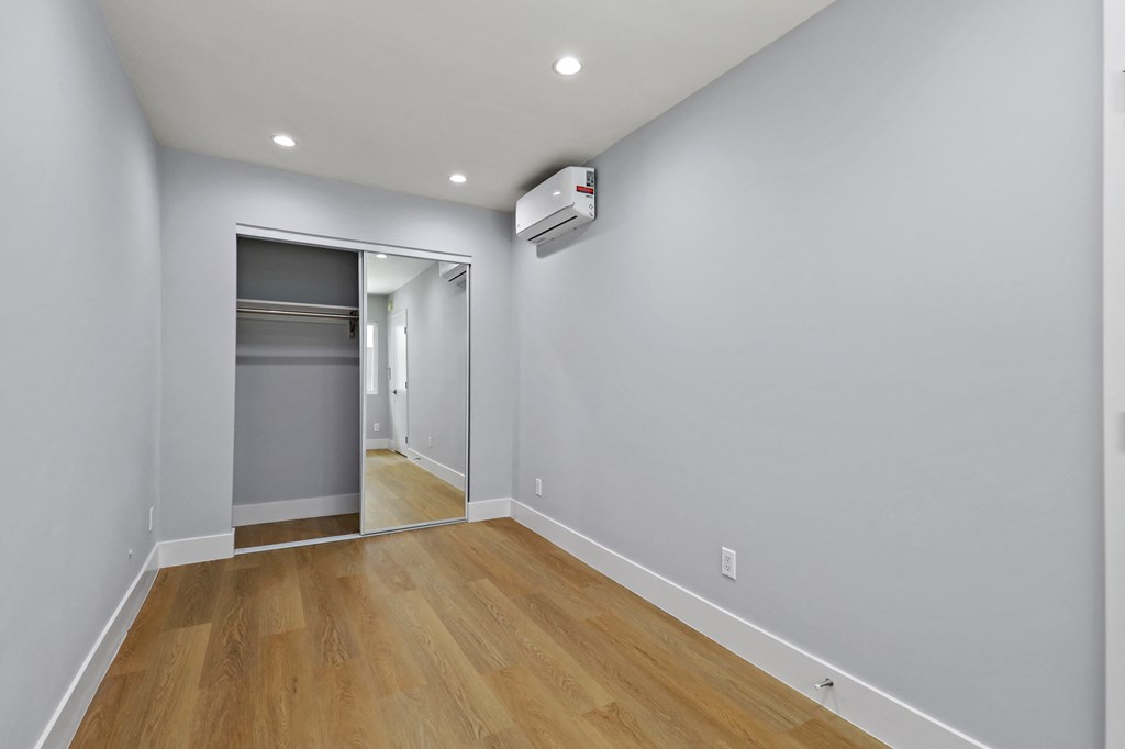 Bedroom with Mirrored Closet