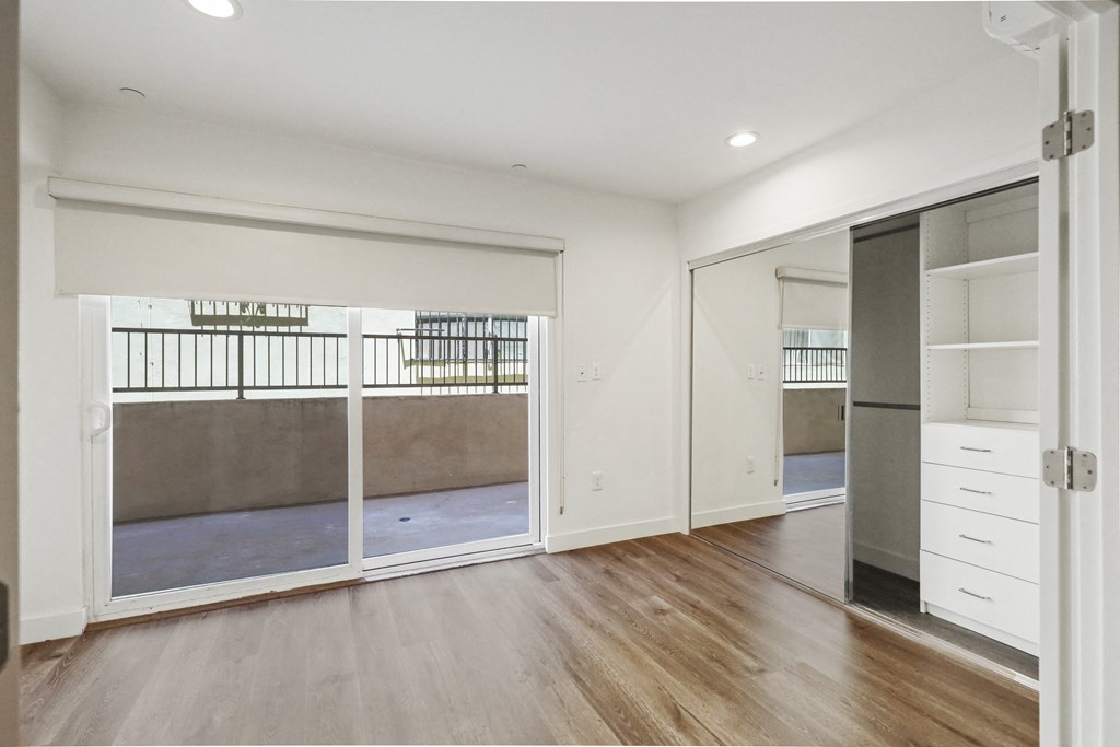 Bedroom with Large Closet with Built-In Organizers