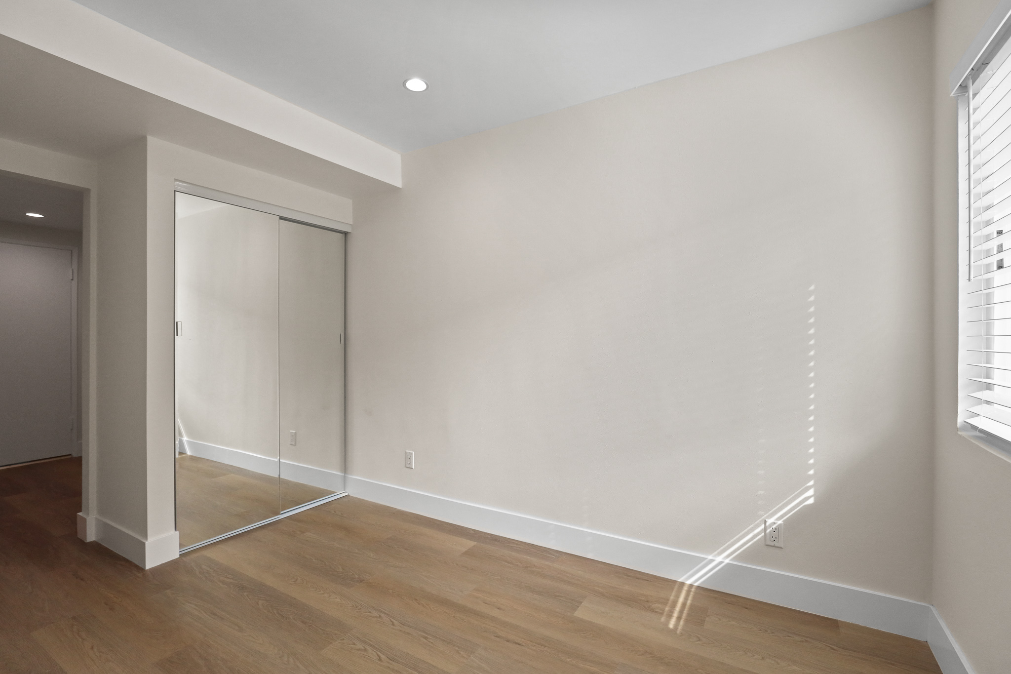 Bedroom with Large Mirrored Closet