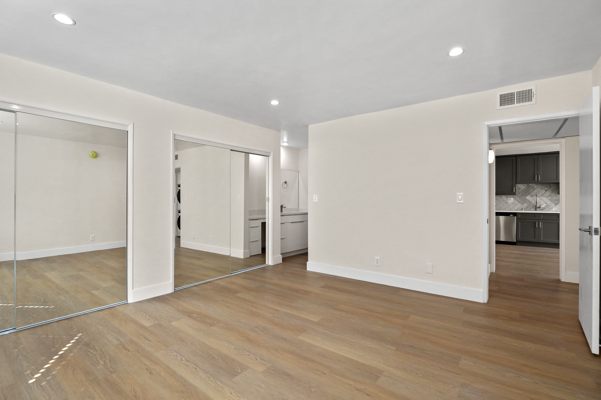 Large Size Bedroom with Double Mirrored Closet and Full-Size Bathroom