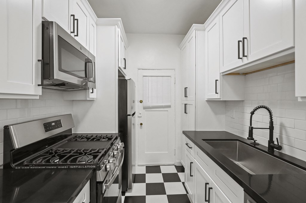 Kitchen with Energy-Efficient Appliances and Ample Cabinet Space Kitchen with Energy-Efficient Appliances and Ample Cabinet Space