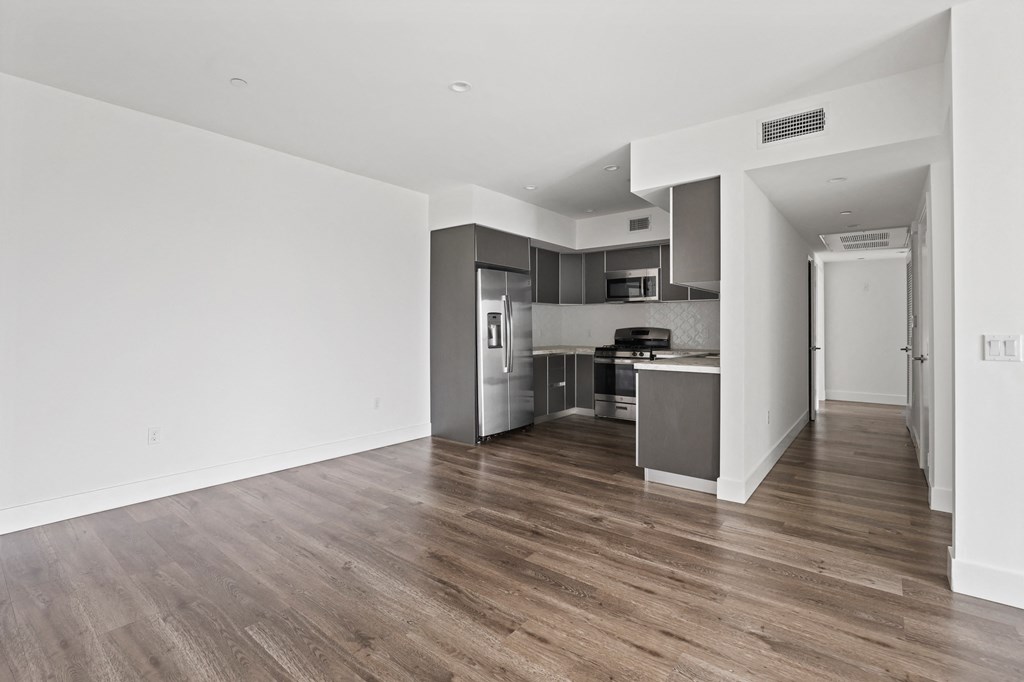 Open-Concept Kitchen and Dining Space with Vinyl Flooring