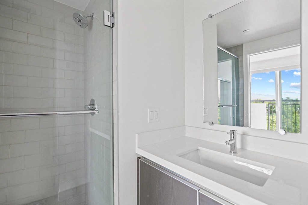 Bathroom with Stand-Up Shower with Glass Door and Vanity Cabinet Storage