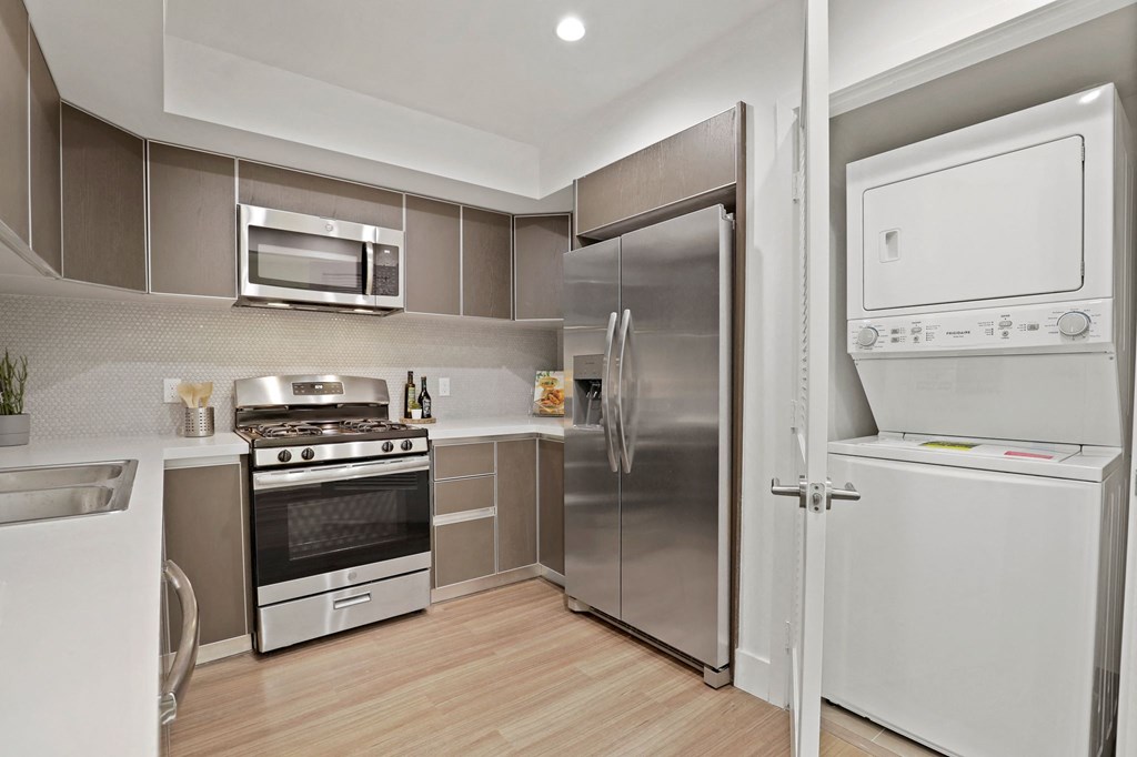 Stainless-Steel Kitchen Appliances with In-Suite Washer & Dryers