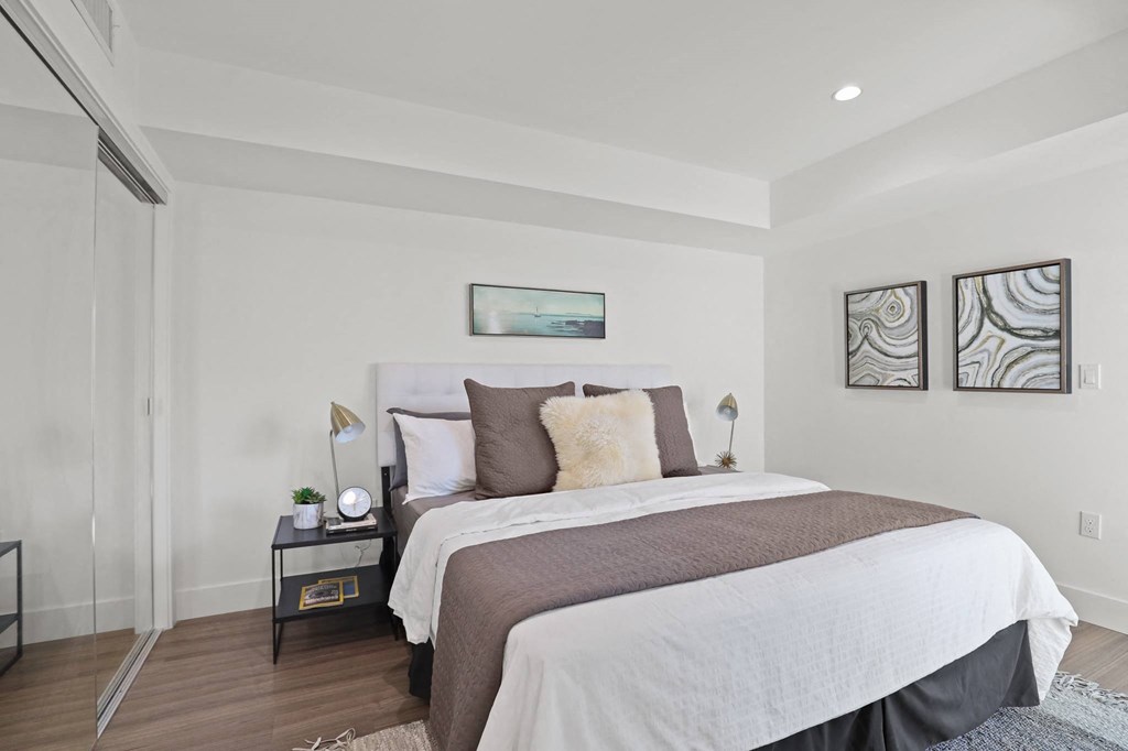 Bedroom with Vinyl Flooring and Recessed Lighting